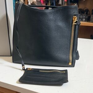 Tom Ford Black Leather Hobo Bag with Gold Hardware
This is the Medium Alix Hobo